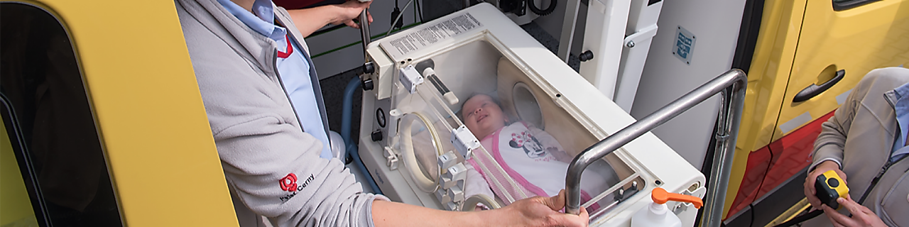 lady operating machine with baby in it