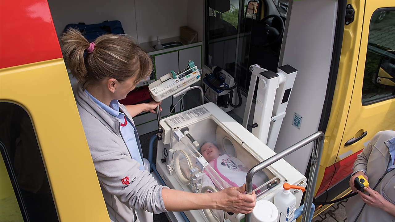 lady operating machine with baby in it
