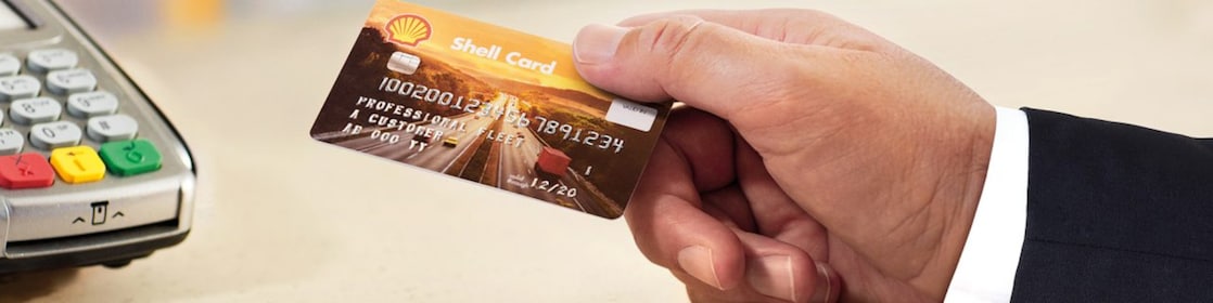 A man holding a Shell card
