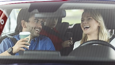 persons are laughing in the car