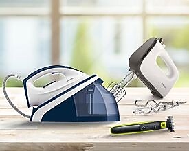 A group of electric irons on a table