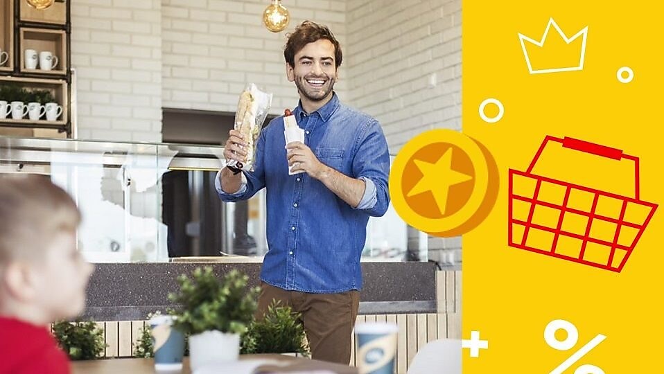 A person holding a sandwich