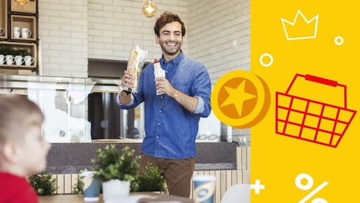 A person holding a sandwich