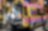 A yellow and pink ambulance with a stretcher