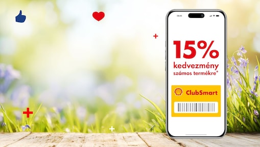 Kellemes tavaszi háttér előtt egy falapon egy mobiltelefon jelenik meg,  melynek Shell Appos kijelzőjén a 15%-os kedvezményes ajánlat olvasható.