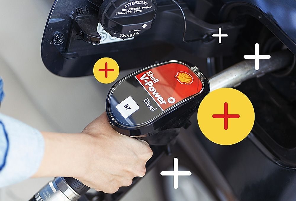 A person holding a gas pump